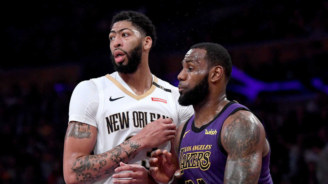 LOS ANGELES, CALIFORNIA - DECEMBER 21: LeBron James #23 of the Los Angeles Lakers guards Anthony Davis #23 of the New Orleans Pelicans during a 112-104 Laker win at Staples Center on December 21, 2018 in Los Angeles, California.
