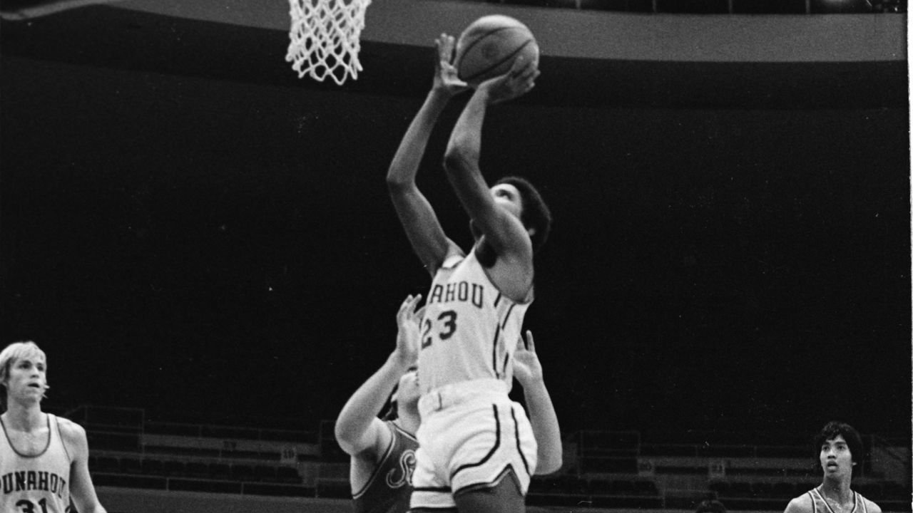 Barack Obama shoots the ball while playing as a guard for the state champion Punahou School basketball team, Hawaii, 1979.