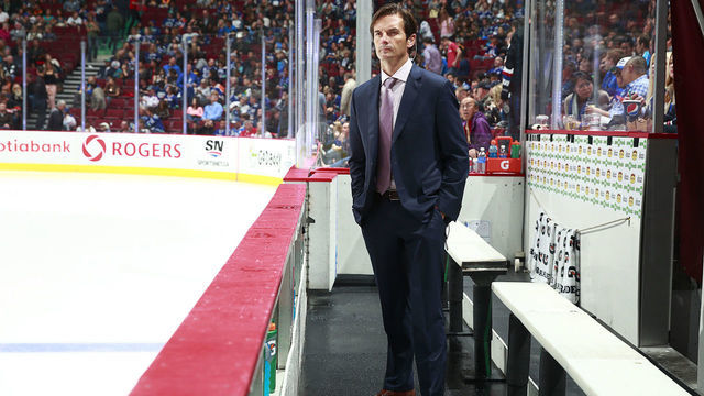 VANCOUVER, BC - OCTOBER 11: Head coach Dallas Eakins of the Edmonton Oilers looks on from the bench during their NHL game against the Vancouver Canucks at Rogers Arena October 11, 2014 in Vancouver, British Columbia, Canada. Vancouver won 5-4 in a shootout.