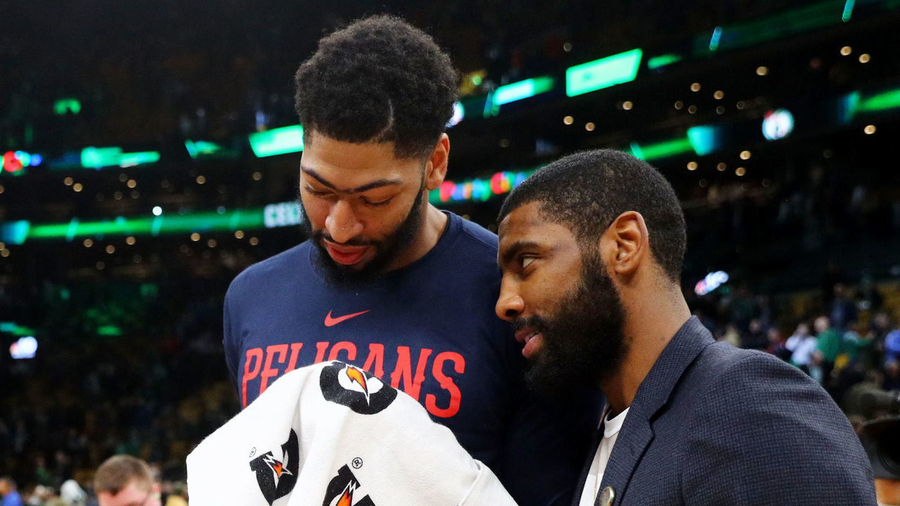 BOSTON, MA - DECEMBER 10: Kyrie Irving #11 of the Boston Celtics and Anthony Davis #23 of the New Orleans Pelicans talk after the game between the Celtics and Pelicans at TD Garden on December 10, 2018 in Boston, Massachusetts.