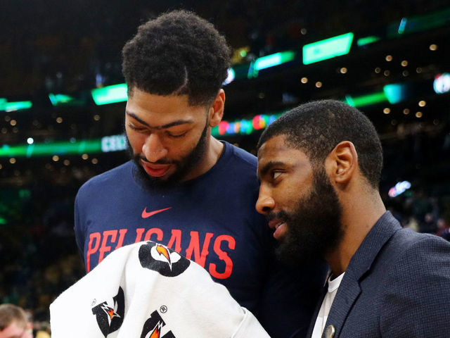 BOSTON, MA - DECEMBER 10: Kyrie Irving #11 of the Boston Celtics and Anthony Davis #23 of the New Orleans Pelicans talk after the game between the Celtics and Pelicans at TD Garden on December 10, 2018 in Boston, Massachusetts.