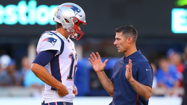EAST RUTHERFORD, NJ - AUGUST 30: New England Patriots quarterback Tom Brady (12) talks with New England Patriots Director of PLayer Personnel Nick Caserio prior to the National Football League game between the New York Giants and the New England Patriots on August 30, 2018 at MetLife Stadium in East Rutherford, NJ.