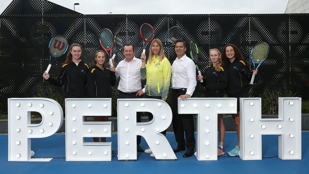 PERTH, AUSTRALIA - JUNE 17: Alicia Molik, Mark McGowan (Premier of Western Australia), Paul Papalia (Western Australian Minister for Tourism) and junior Tennis West State players pose after Tennis Australia announce the 2019 Fed Cup Final venue at RAC Arena on June 17, 2019 in Perth, Australia.