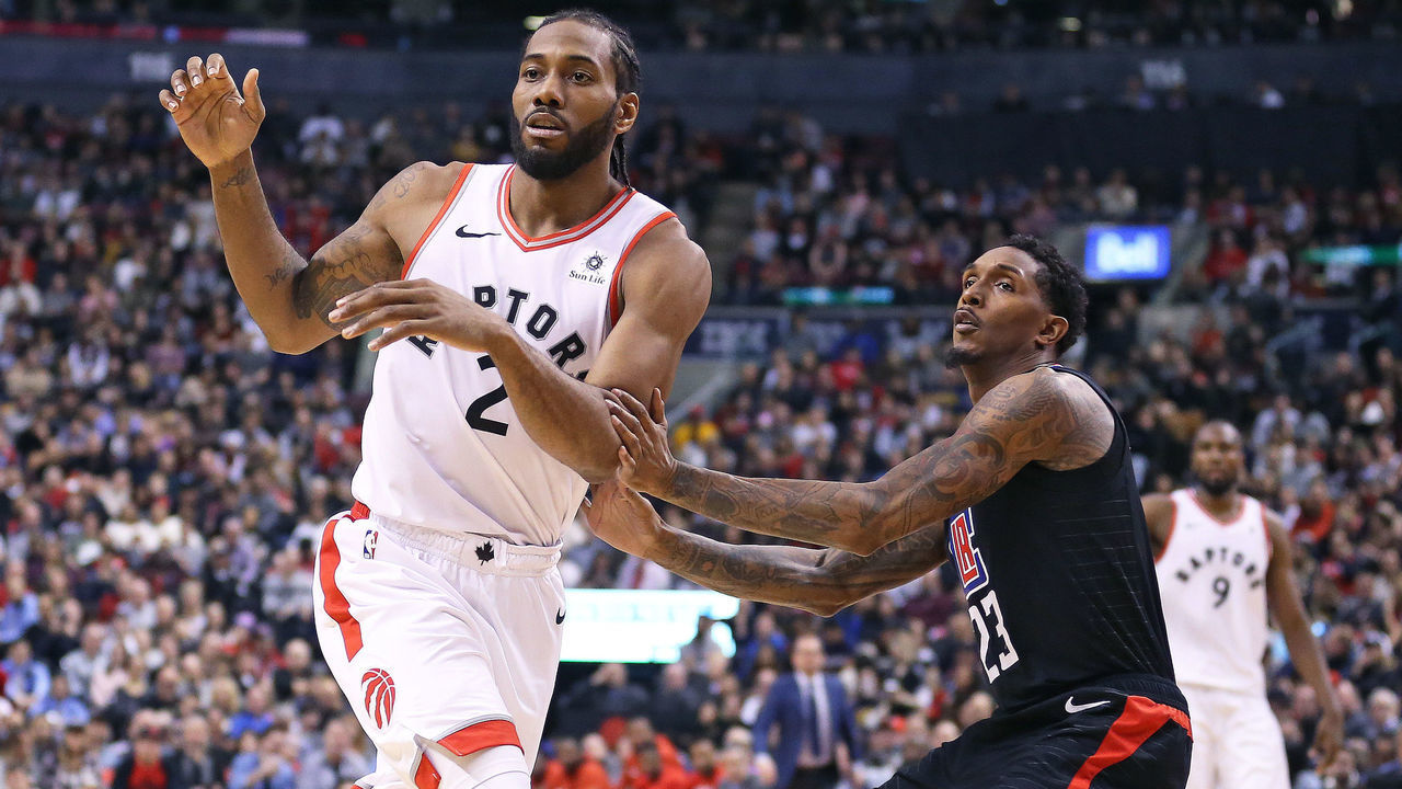 TORONTO, ON - FEBRUARY 3: Kawhi Leonard #2 of the Toronto Raptors looks for a pass in front of Lou Williams #23 of the Los Angeles Clippers in an NBA game at Scotiabank Arena on February 3, 2019 in Toronto, Ontario, Canada. The Raptors defeated the Clippers 121-103. NOTE TO USER: user expressly acknowledges and agrees by downloading and/or using this Photograph, user is consenting to the terms and conditions of the Getty Images Licence Agreement.