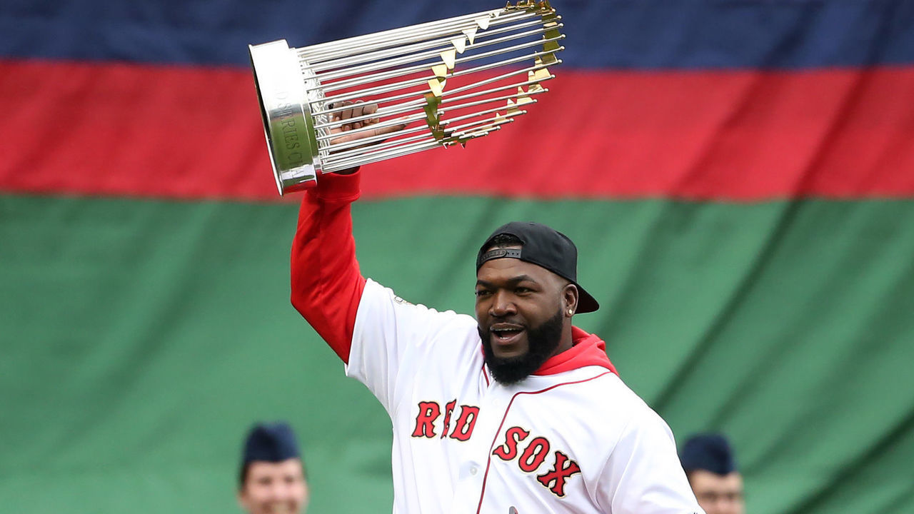 BOSTON MA. - APRIL 9: Former Red Sox player David Ortiz carries a World Series trophy onto the field during pregame ceremonies prior to Boston's home opener against the Toronto Blue Jays at Fenway Park on April 9, 2019 in Boston, Massachusetts. (Staff Photo By Nancy Lane/MediaNews Group/Boston Herald via Getty Images)