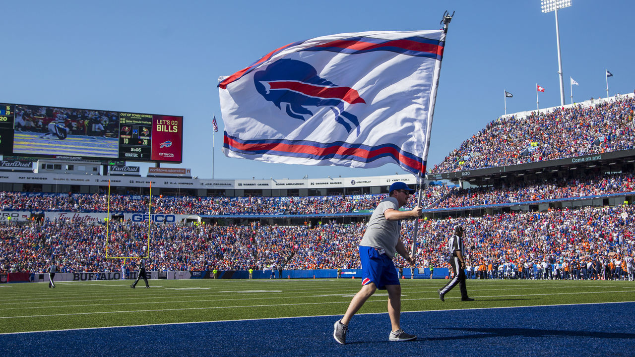 ORCHARD PARK, NY - SEPTEMBER 24: A member of the Buffalo Bills stadium crew waves a team flag to celebrate a scoring drive against the Denver Broncos on September 24, 2017 at New Era Field in Orchard Park, New York. Buffalo defeats denver 26-16. *** Local Caption ***