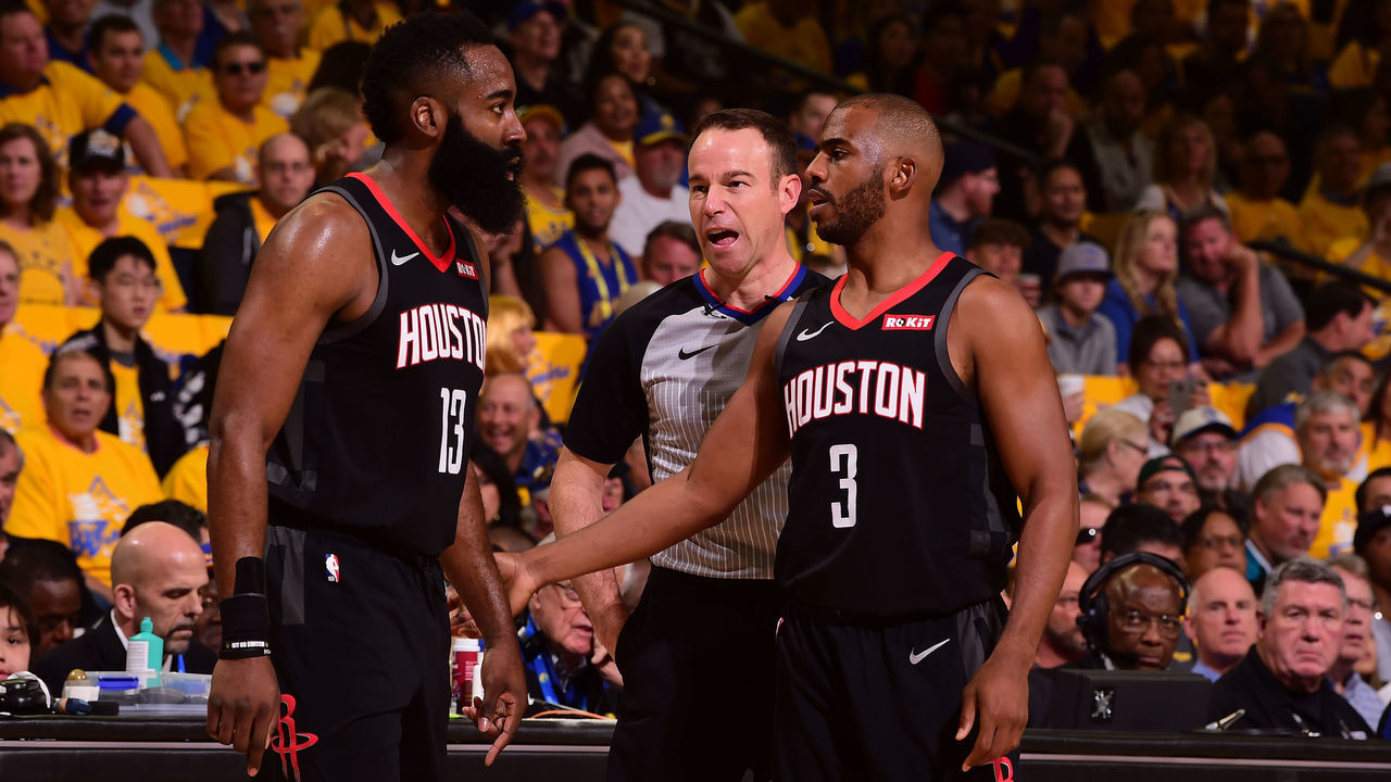 OAKLAND, CA - APRIL 28: James Harden #13, and Chris Paul #3 of the Houston Rockets talks during Game One of the Western Conference Semifinals of the 2019 NBA Playoffs against the Golden State Warriors on April 28, 2019 at ORACLE Arena in Oakland, California. Mandatory Copyright Notice: Copyright 2019 NBAE
