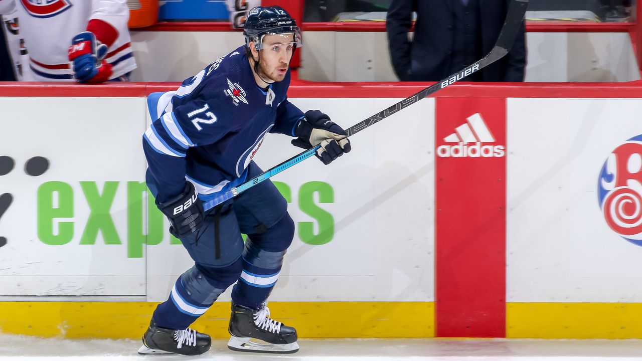 WINNIPEG, MB - MARCH 30: Kevin Hayes #12 of the Winnipeg Jets follows the play down the ice during third period action against the Montreal Canadiens at the Bell MTS Place on March 30, 2019 in Winnipeg, Manitoba, Canada. The Habs defeated the Jets 3-1.