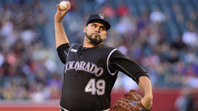 PHOENIX, ARIZONA - JUNE 18: Antonio Senzatela #49 of the Colorado Rockies delivers a pitch in the first inning of a MLB game against the Arizona Diamondbacks at Chase Field on June 18, 2019 in Phoenix, Arizona.