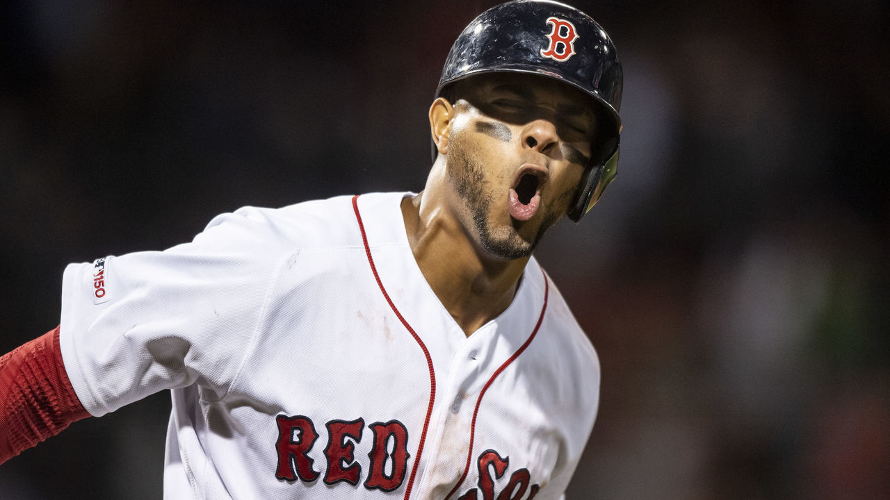 BOSTON, MA - JUNE 13: Xander Bogaerts #2 of the Boston Red Sox reacts after hitting a go ahead solo home run during the seventh inning of a game against the Texas Rangers on June 13, 2019 at Fenway Park in Boston, Massachusetts.