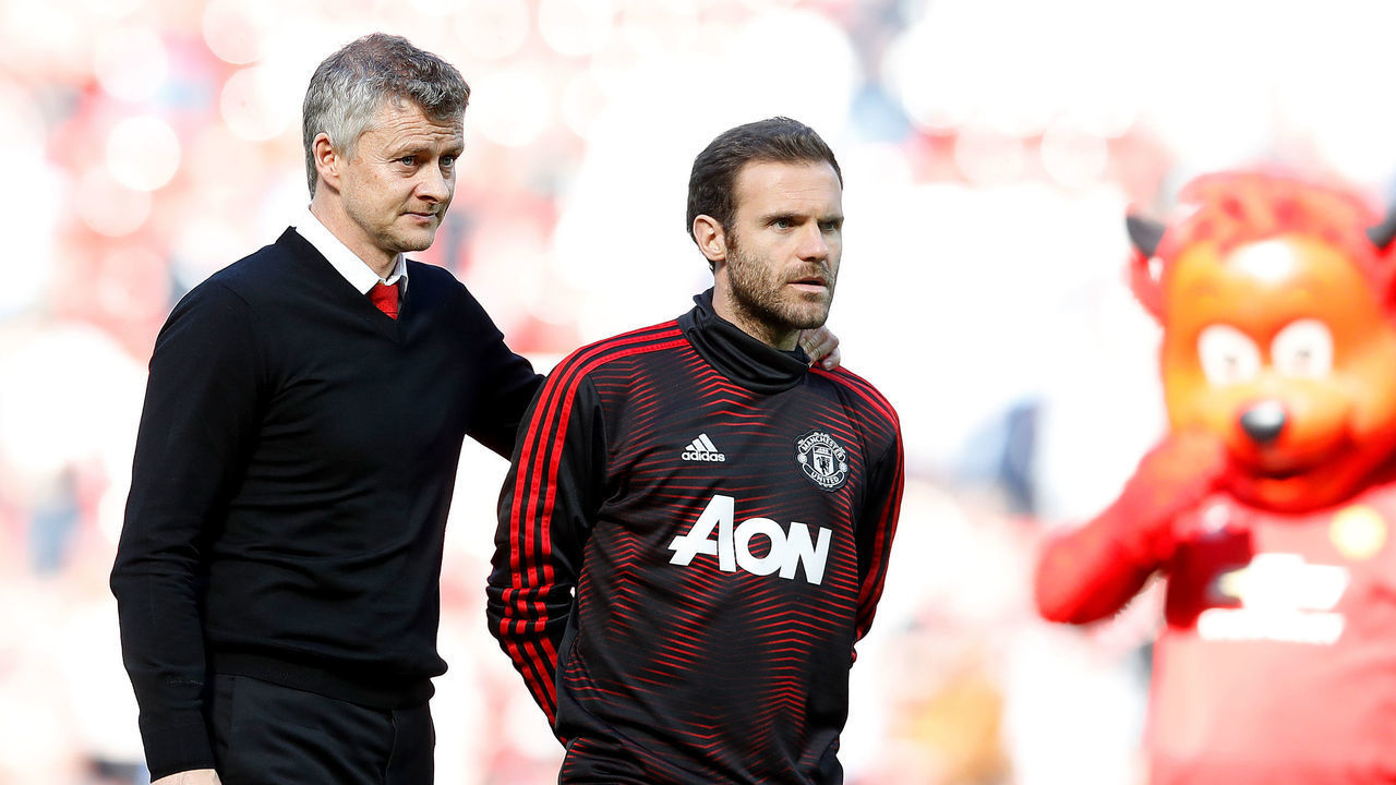 Manchester United manager Ole Gunnar Solskjaer (left) with Juan Mata (right) after the final whistle during the Premier League match at Old Trafford, Manchester.