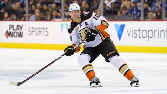 VANCOUVER, BC - MARCH 26: Anaheim Ducks Left Wing Corey Perry (10) passes the puck during their NHL game against the Vancouver Canucks at Rogers Arena on March 26, 2019 in Vancouver, British Columbia, Canada. Anaheim won 5-4.