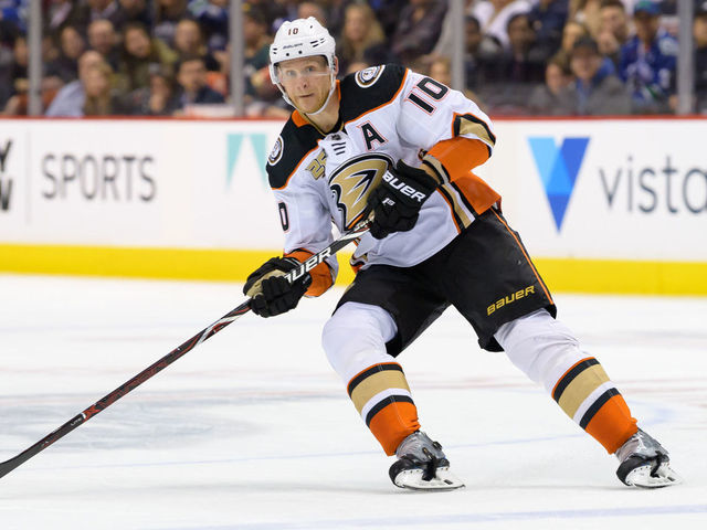 VANCOUVER, BC - MARCH 26: Anaheim Ducks Left Wing Corey Perry (10) passes the puck during their NHL game against the Vancouver Canucks at Rogers Arena on March 26, 2019 in Vancouver, British Columbia, Canada. Anaheim won 5-4.