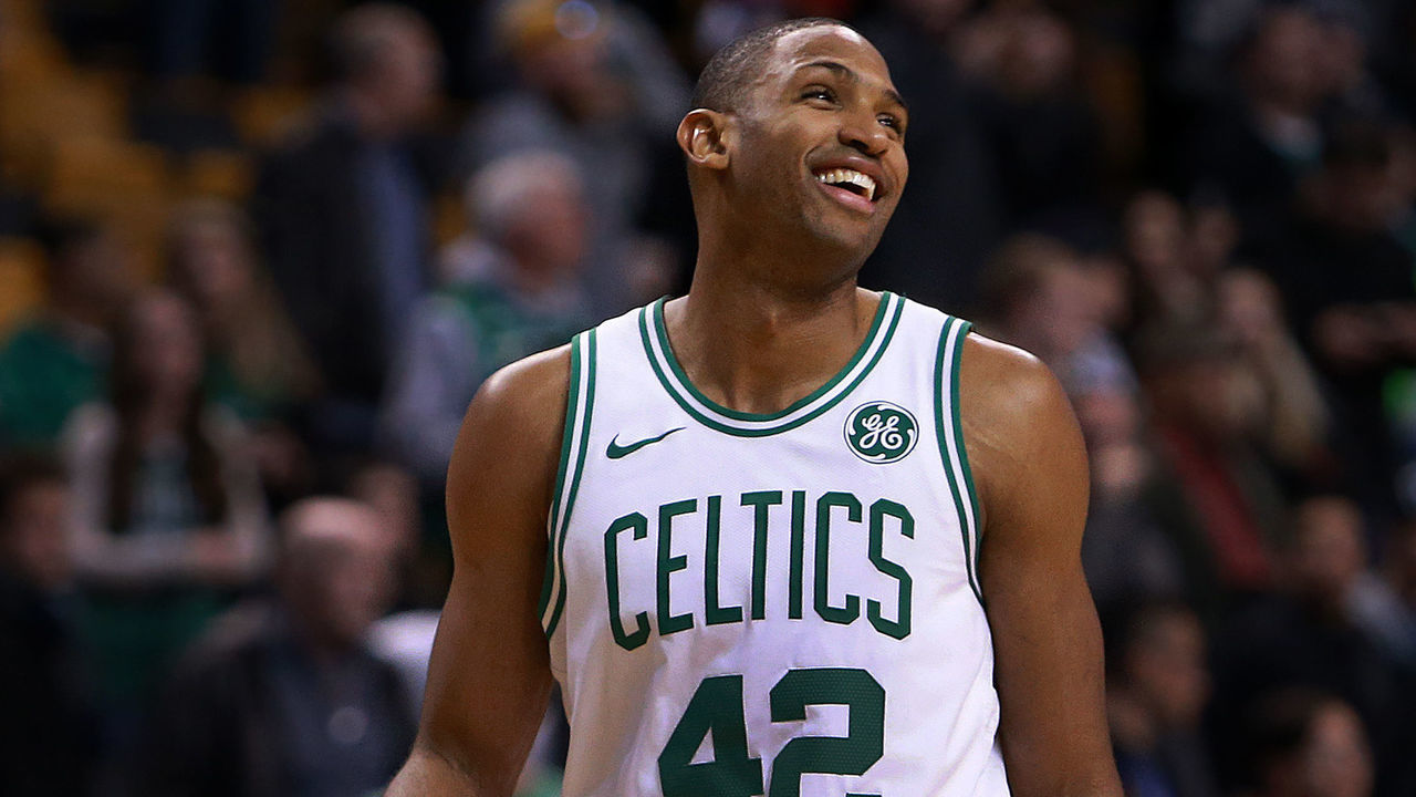 BOSTON - DECEMBER 6: Boston Celtics' Al Horford reacts during the final seconds of the game as the clock ticks down to a Boston victory. Head coach Brad Stevens stands at background left. The Boston Celtics host the Dallas Mavericks in a regular season NBA basketball game at TD Garden in Boston on Dec. 6, 2017.