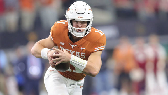 ARLINGTON, TX - DECEMBER 01: Texas (11) Sam Ehlinger (QB) runs the ball in the Big 12 Championship Game between the Oklahoma Sooners and the Texas Longhorns on December 1st at AT&T Stadium in Arlington, TX.