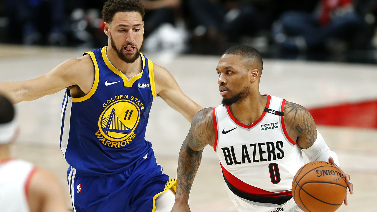 PORTLAND, OREGON - MAY 18: Damian Lillard #0 of the Portland Trail Blazers dribbles against Klay Thompson #11 of the Golden State Warriors during the first half in game three of the NBA Western Conference Finals at Moda Center on May 18, 2019 in Portland, Oregon.