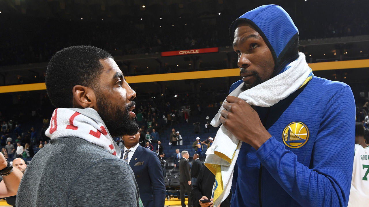 OAKLAND, CA - MARCH 5: Kyrie Irving #11 of the Boston Celtics speaks with Kevin Durant #35 of the Golden State Warriors after the game on March 5, 2019 at ORACLE Arena in Oakland, California. NOTE TO USER: User expressly acknowledges and agrees that, by downloading and or using this photograph, user is consenting to the terms and conditions of Getty Images License Agreement. Mandatory Copyright Notice: Copyright 2019 NBAE