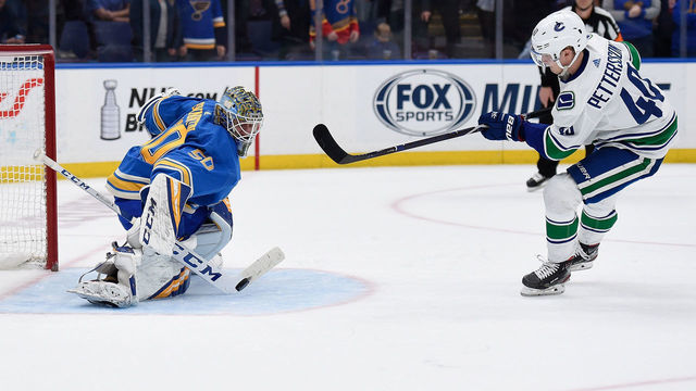 ST. LOUIS, MO - APRIL 6: Jordan Binnington #50 of the St. Louis Blues blocks a shoot out shot from Elias Pettersson #40 of the Vancouver Canucks at Enterprise Center on April 6, 2019 in St. Louis, Missouri.