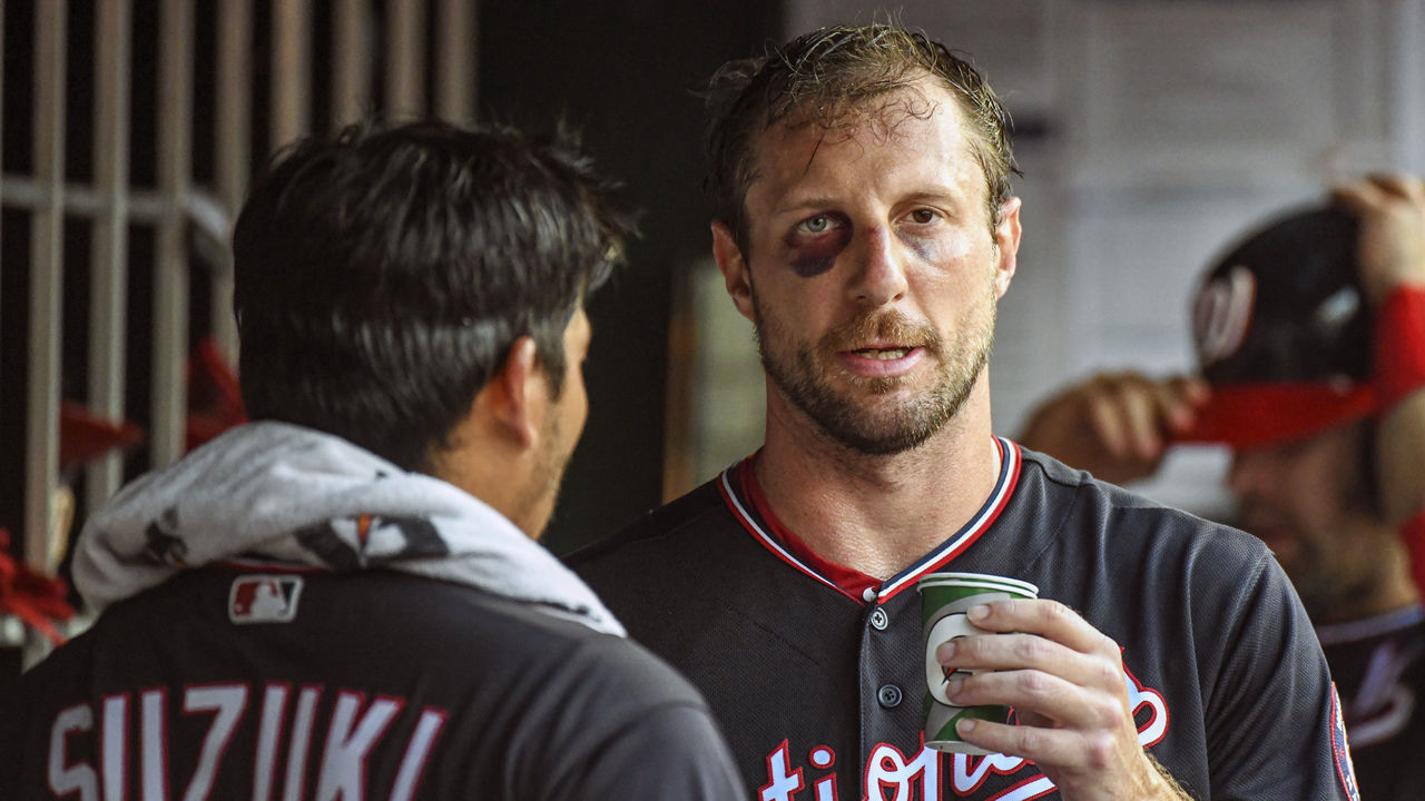 WASHINGTON, DC - JUNE 19: Washington Nationals starting pitcher Max Scherzer (31) talks with catcher Kurt Suzuki (28) in the dugout after pitching the third inning during the game between the Philadelphia Phillies and the Washington Nationals on June 19, 2019, at Nationals Park, in Washington D.C. Scherzer broke his nose and got a black eye on Monday after fouling off a bunt during batting practice.