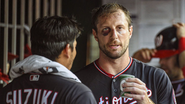 WASHINGTON, DC - JUNE 19: Washington Nationals starting pitcher Max Scherzer (31) talks with catcher Kurt Suzuki (28) in the dugout after pitching the third inning during the game between the Philadelphia Phillies and the Washington Nationals on June 19, 2019, at Nationals Park, in Washington D.C. Scherzer broke his nose and got a black eye on Monday after fouling off a bunt during batting practice.