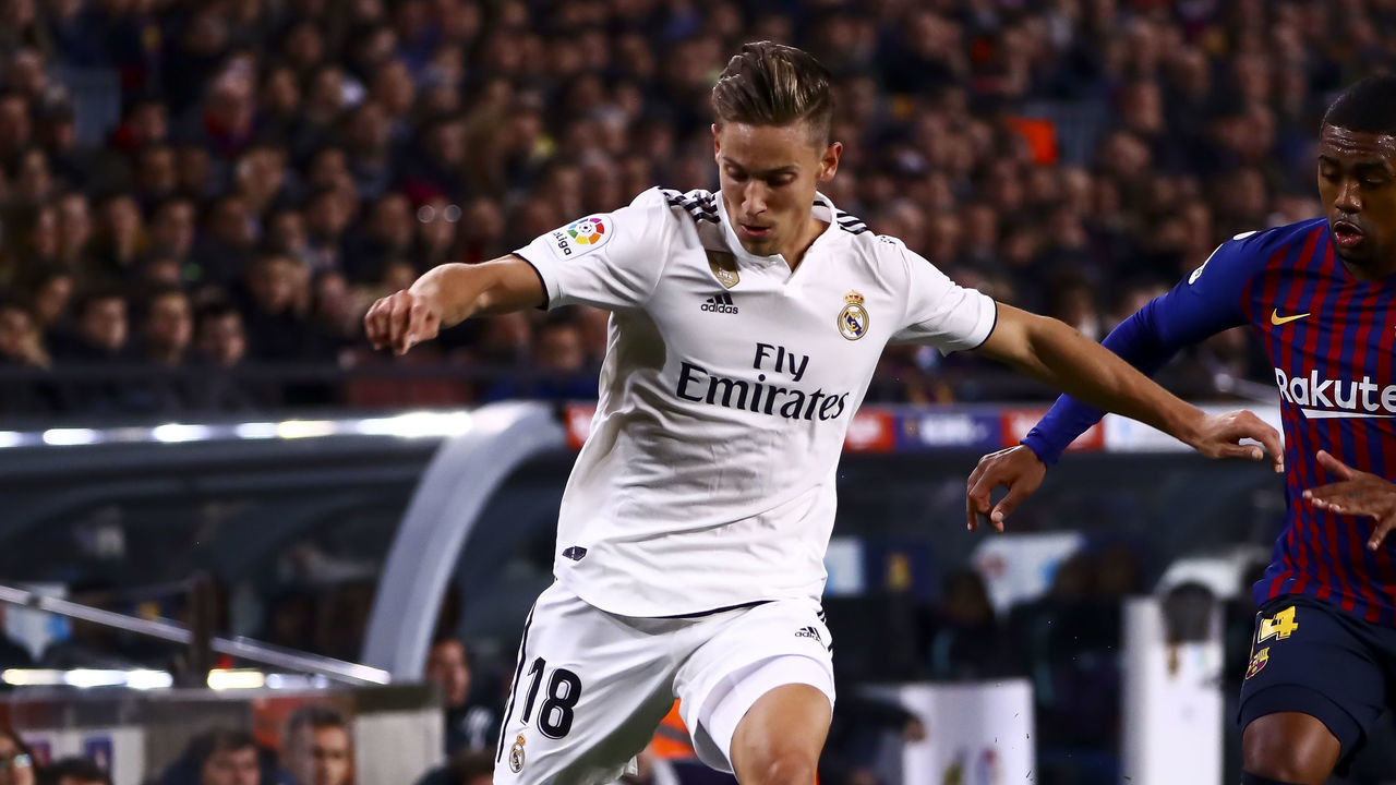 MARCOS LLORENTE (L) and FC Barcelona's forward Malcom during semifinal of spanish King Cup frist leg match between FC Barcelona and Real Madrid at Nou Camp Stadium on February 6, 2019.