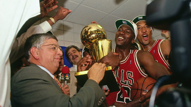 PHOENIX - JUNE 20: NBA Commissioner David Stern presents Michael Jordan and the Chicago Bulls the championship trophy after the Bulls defeated the Phoenix Suns in Game Six of the 1993 NBA Finals on June 20, 1993 at America West Arena in Phoenix, Arizona. Mandatory Copyright Notice: Copyright 1993 NBAE