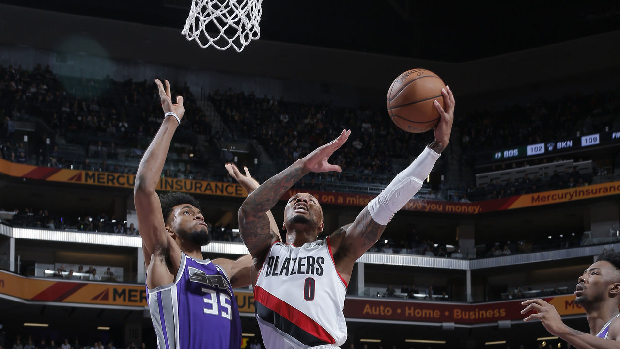 SACRAMENTO, CA - JANUARY 14: Damian Lillard #0 of the Portland Trail Blazers goes up for the shot against Marvin Bagley III #35 of the Sacramento Kings on January 14, 2019 at Golden 1 Center in Sacramento, California. NOTE TO USER: User expressly acknowledges and agrees that, by downloading and or using this photograph, User is consenting to the terms and conditions of the Getty Images Agreement. Mandatory Copyright Notice: Copyright 2019 NBAE