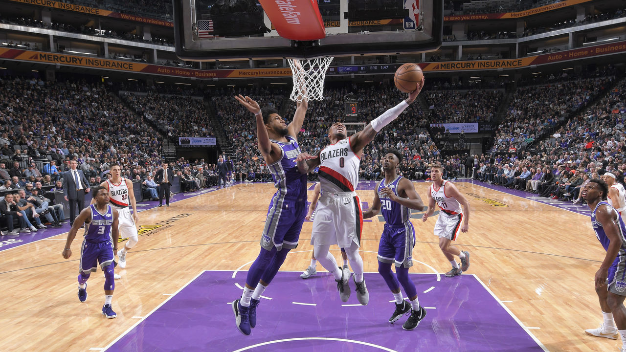 SACRAMENTO, CA - JANUARY 14: Damian Lillard #0 of the Portland Trail Blazers shoots a layup against Marvin Bagley III #35 of the Sacramento Kings on January 14, 2019 at Golden 1 Center in Sacramento, California. NOTE TO USER: User expressly acknowledges and agrees that, by downloading and or using this photograph, User is consenting to the terms and conditions of the Getty Images Agreement. Mandatory Copyright Notice: Copyright 2019 NBAE