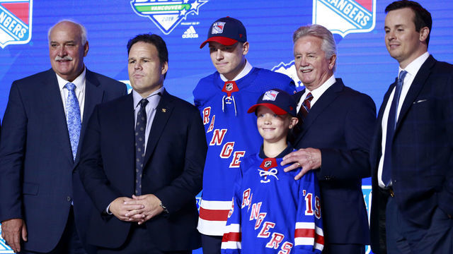 VANCOUVER, BRITISH COLUMBIA - JUNE 21: Kaapo Kakko (third from left), second overall pick by the New York Rangers, poses for a group photo with team personnel during the first round of the 2019 NHL Draft at Rogers Arena on June 21, 2019 in Vancouver, Canada.