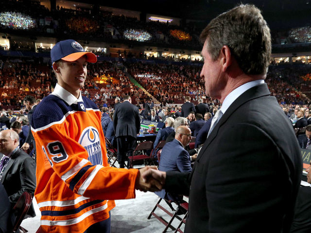 VANCOUVER, BRITISH COLUMBIA - JUNE 21: Philip Broberg, eighth overall pick of the Edmonton Oilers, shakes the hand of Wayne Gretzky on the draft floor during the first round of the 2019 NHL Draft at Rogers Arena on June 21, 2019 in Vancouver, Canada.