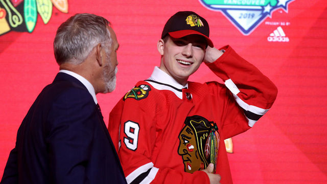 VANCOUVER, BRITISH COLUMBIA - JUNE 21: Kirby Dach reacts after being selected third overall by the Chicago Blackhawks during the first round of the 2019 NHL Draft at Rogers Arena on June 21, 2019 in Vancouver, Canada.