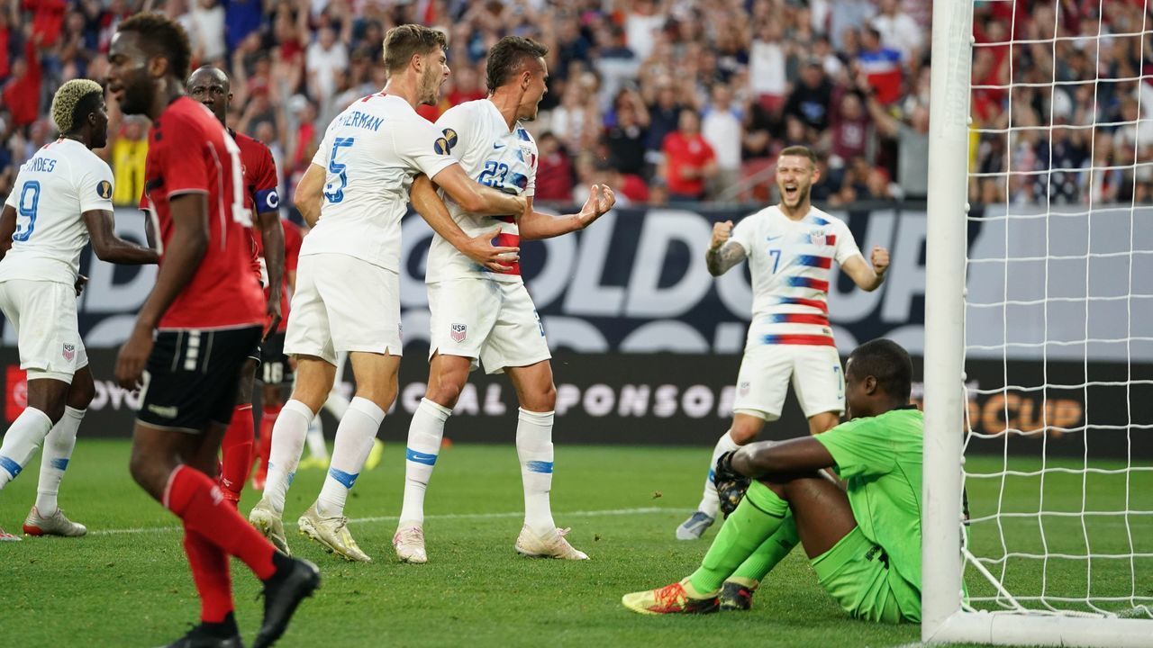 Aaron Long (C) of the US celebrates with teammates after scoring goal against Trinidad and Tobago during their CONCACAF Gold Cup group stage football match at First Energy Stadium in Cleveland, Ohio on June 22, 2019.