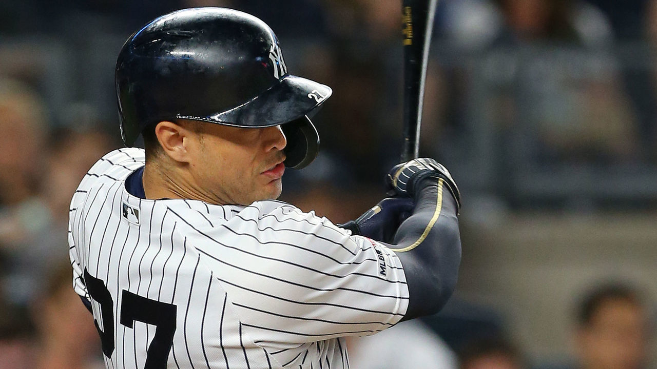 NEW YORK, NY - JUNE 22: Giancarlo Stanton #27 of the New York Yankees hits a two-run single against the Houston Astros during the seventh inning of a baseball game at Yankee Stadium on June 22, 2019 in the Bronx borough of New York City. The Yankees defeated the Astros 7-5.