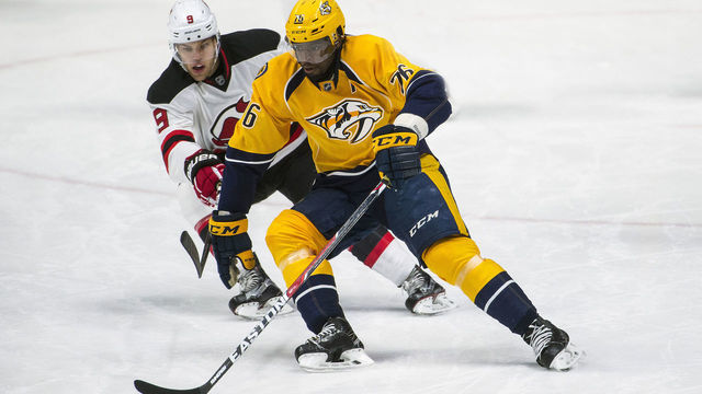 NASHVILLE, TN - DECEMBER 03: P.K. Subban #76 of the Nashville Predators skates with the puck as Taylor Hall #9 of the New Jersey Devils chases during a NHL game at Bridgestone Arena on December 3, 2016 in Nashville, Tennessee.