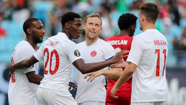 CHARLOTTE, NC - JUNE 23: Jonathan David of Canada celebrates after scoring a goal to make it 7-0 during the Group A 2019 CONCACAF Gold Cup match between Canada v Cuba at Bank of America Stadium on June 23, 2019 in Charlotte, North Carolina.