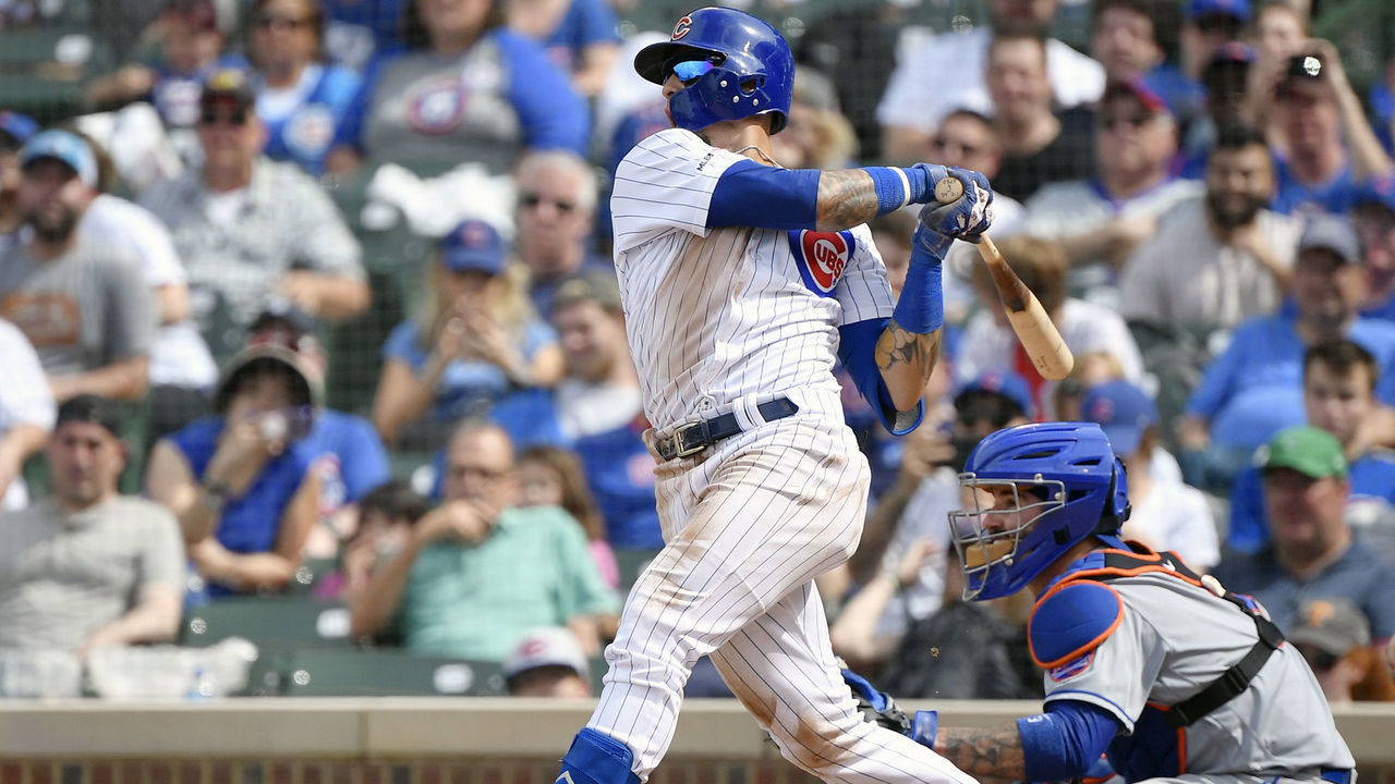 CHICAGO, ILLINOIS - JUNE 23: Javier Baez #9 of the Chicago Cubs hits a three run home run in the eight inning against the New York Mets at Wrigley Field on June 23, 2019 in Chicago, Illinois.
