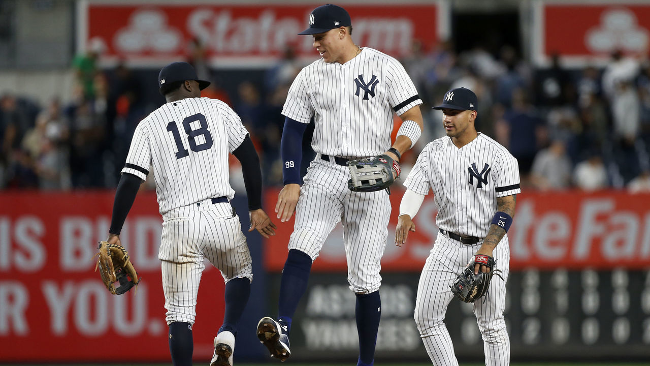 NEW YORK, NEW YORK - JUNE 21: Didi Gregorius #18, Aaron Judge #99 and Gleyber Torres #25 of the New York Yankees celebrate after defeating the Houston Astros at Yankee Stadium on June 21, 2019 in New York City.