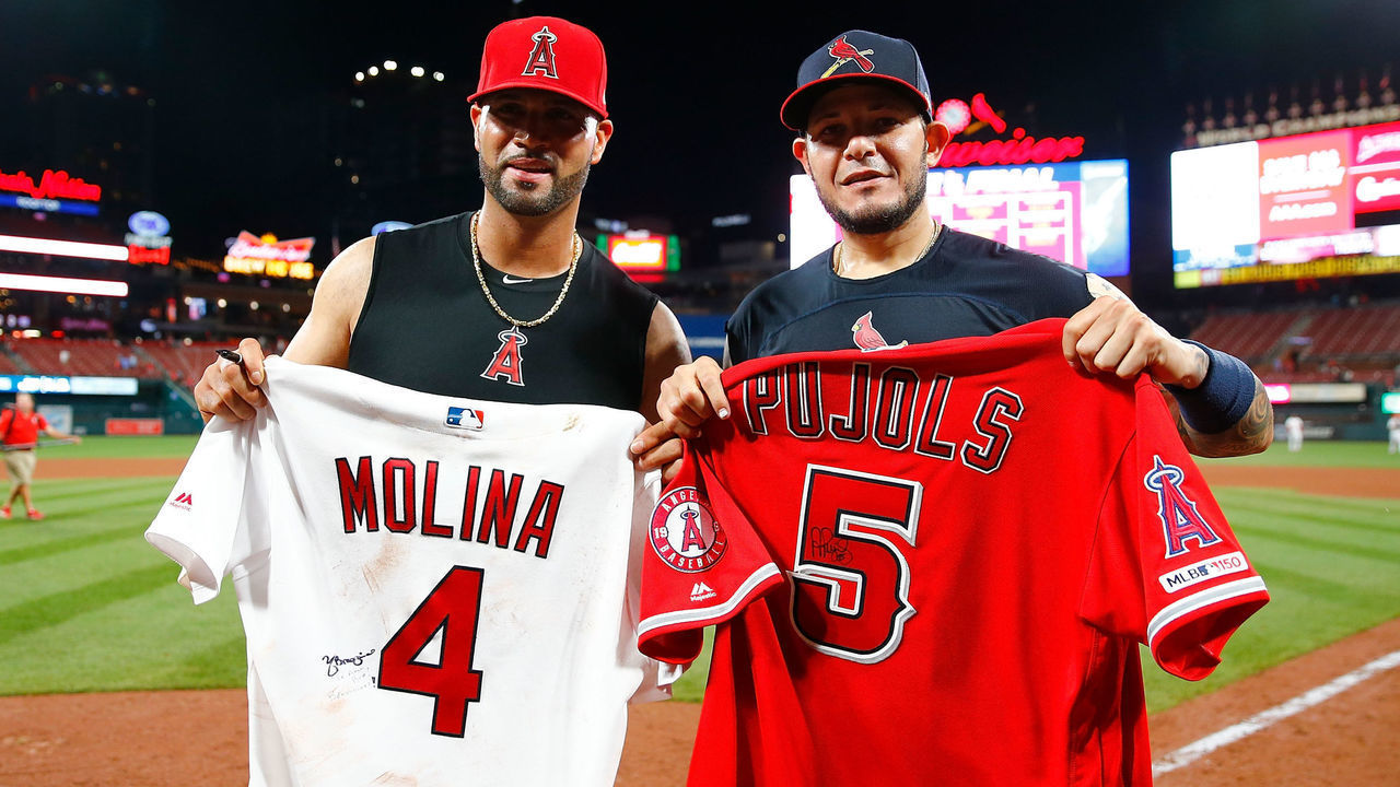 ST LOUIS, MO - JUNE 23: Albert Pujols #5 of the Los Angeles Angels of Anaheim and Yadier Molina #4 of the St. Louis Cardinals pose for a photo after exchanging jerseys after their game at Busch Stadium on June 23, 2019 in St. Louis, Missouri.