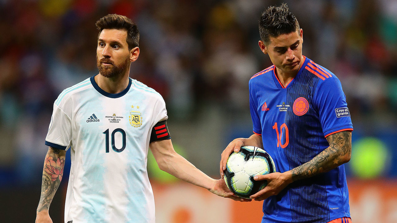 SALVADOR, BRAZIL - JUNE 15: Lionel Messi of Argentina hands the ball to James Rodriguez of Colombia during the Copa America Brazil 2019 group B match between Argentina and Colombia at Arena Fonte Nova on June 15, 2019 in Salvador, Brazil.