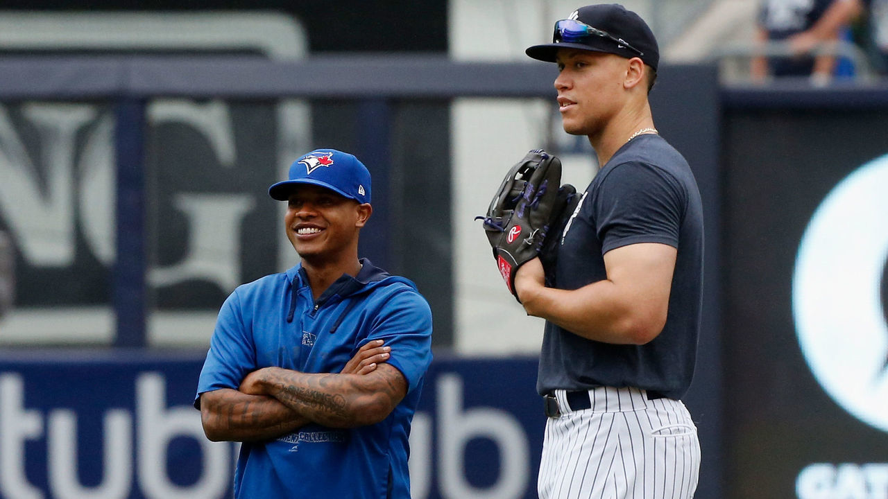 NEW YORK, NY - AUGUST 19: Marcus Stroman #6 of the Toronto Blue Jays and Aaron Judge #99 of the New York Yankees talk on the field before a game at Yankee Stadium on August 19, 2018 in the Bronx borough of New York City.