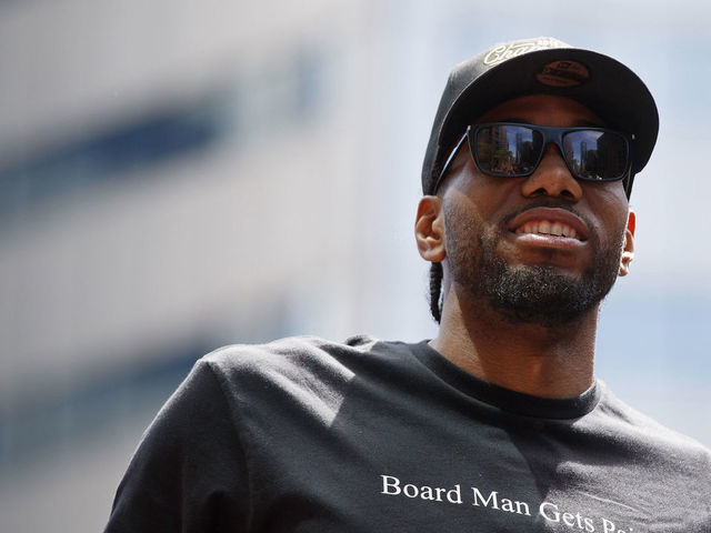 TORONTO, ON - JUNE 17: Kawhi Leonard #2 of the Toronto Raptors looks on from the team bus during the Toronto Raptors Championship Victory Parade on June 17, 2019 in Toronto, Ontario. NOTE TO USER: User expressly acknowledges and agrees that, by downloading and/or using this photograph, user is consenting to the terms and conditions of Getty Images License Agreement. Mandatory Copyright Notice: Copyright 2019 NBAE