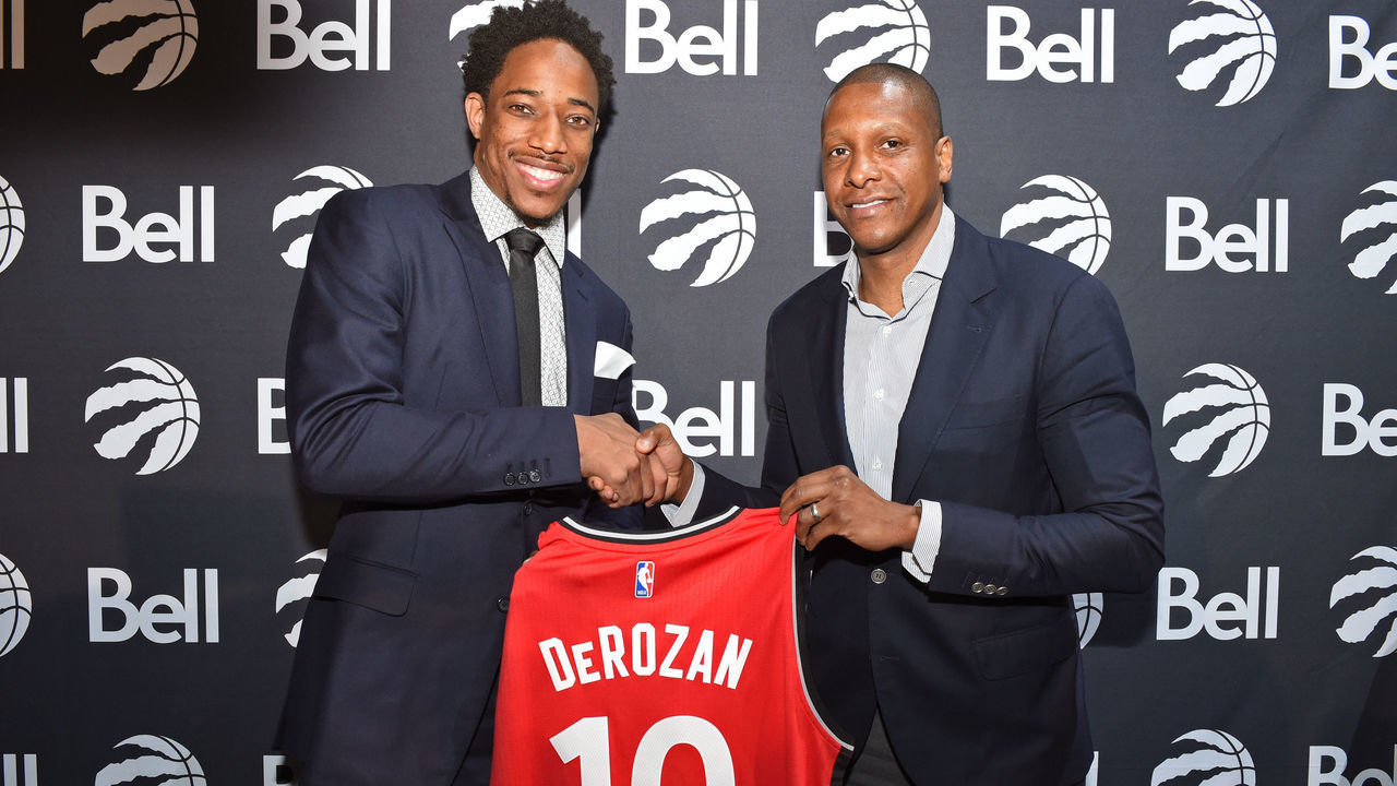 TORONTO, CANADA - JULY 14: DeMar DeRozan #10 and Masai Ujiri of the Toronto Raptors pose for a photo during a press conference after announcing his new deal on July 14, 2016 at the Real Sports Bar & Grill in Toronto, Ontario, Canada. Mandatory Copyright Notice: Copyright 2016 NBAE