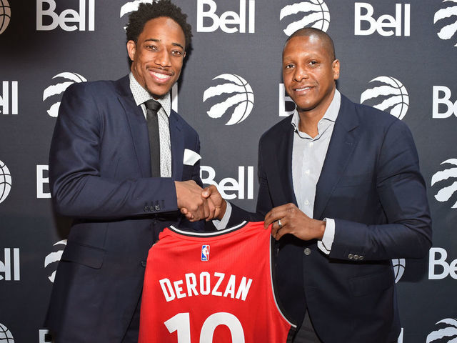 TORONTO, CANADA - JULY 14: DeMar DeRozan #10 and Masai Ujiri of the Toronto Raptors pose for a photo during a press conference after announcing his new deal on July 14, 2016 at the Real Sports Bar & Grill in Toronto, Ontario, Canada. Mandatory Copyright Notice: Copyright 2016 NBAE