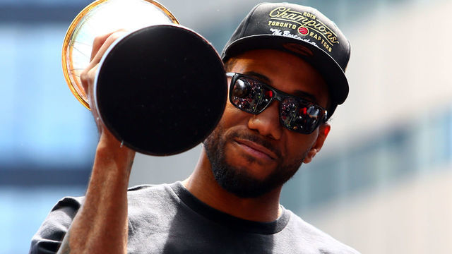 TORONTO, ON - JUNE 17: Kawhi Leonard #2 of the Toronto Raptors holds the MVP trophy during the Toronto Raptors Victory Parade on June 17, 2019 in Toronto, Canada. The Toronto Raptors beat the Golden State Warriors 4-2 to win the 2019 NBA Finals.
