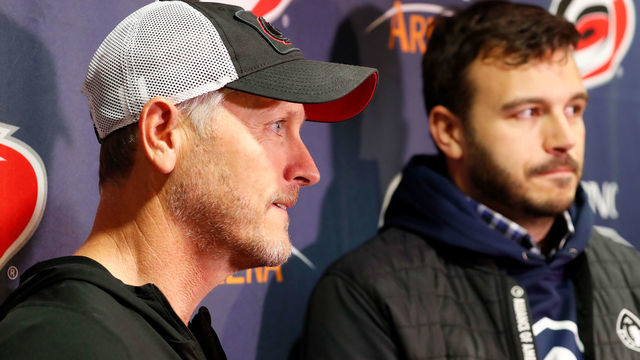RALEIGH, NC - FEBRUARY 19: Tom Dundon, left, owner of the Carolina Hurricanes, and Charlie Ebersol, of the Alliance of American Football, speak to media before an NHL game against the New York Rangers on February 19, 2019 at PNC Arena in Raleigh, North Carolina.