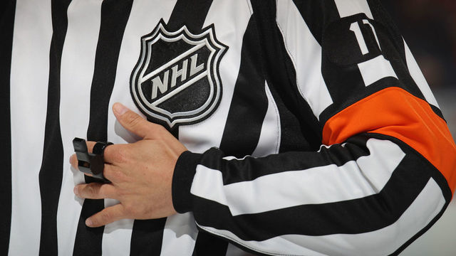 NEWARK, NJ - OCTOBER 18: Referee Frederick L'Ecuyer #17 works the game between the New Jersey Devils and the Colorado Avalanche at the Prudential Center on October 18, 2018 in Newark, New Jersey. The Avalanche defeated the Devils 5-3.