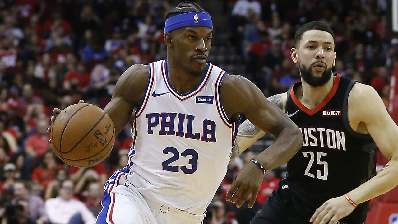 HOUSTON, TEXAS - MARCH 08: Jimmy Butler #23 of the Philadelphia 76ers drives around Austin Rivers #25 of the Houston Rockets at Toyota Center on March 08, 2019 in Houston, Texas.
