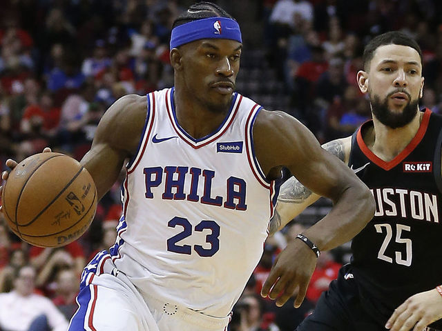 HOUSTON, TEXAS - MARCH 08: Jimmy Butler #23 of the Philadelphia 76ers drives around Austin Rivers #25 of the Houston Rockets at Toyota Center on March 08, 2019 in Houston, Texas.