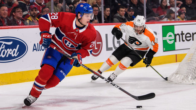 MONTREAL, QC - FEBRUARY 21: Montreal Canadiens defenseman Mike Reilly (28) skates with the puck while being chased by Philadelphia Flyers center Phil Varone (44) during the first period of the NHL game between the Philadelphia Flyers and the Montreal Canadiens on february 21, 2019, at the Bell Centre in Montreal, QC