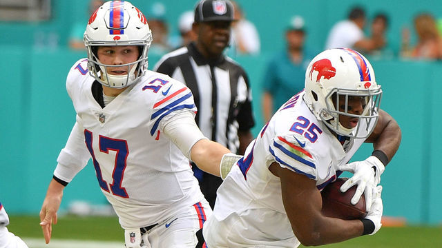 MIAMI, FL - DECEMBER 02: Josh Allen #17 hands the ball off to LeSean McCoy #25 of the Buffalo Bills during the game against the Miami Dolphins at Hard Rock Stadium on December 2, 2018 in Miami, Florida.